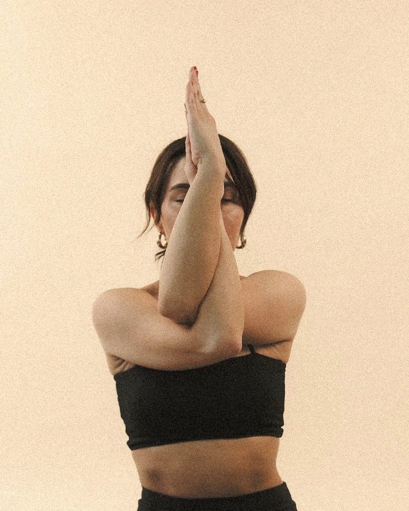 Eagle arms shoulder stretch for a stiff upper back